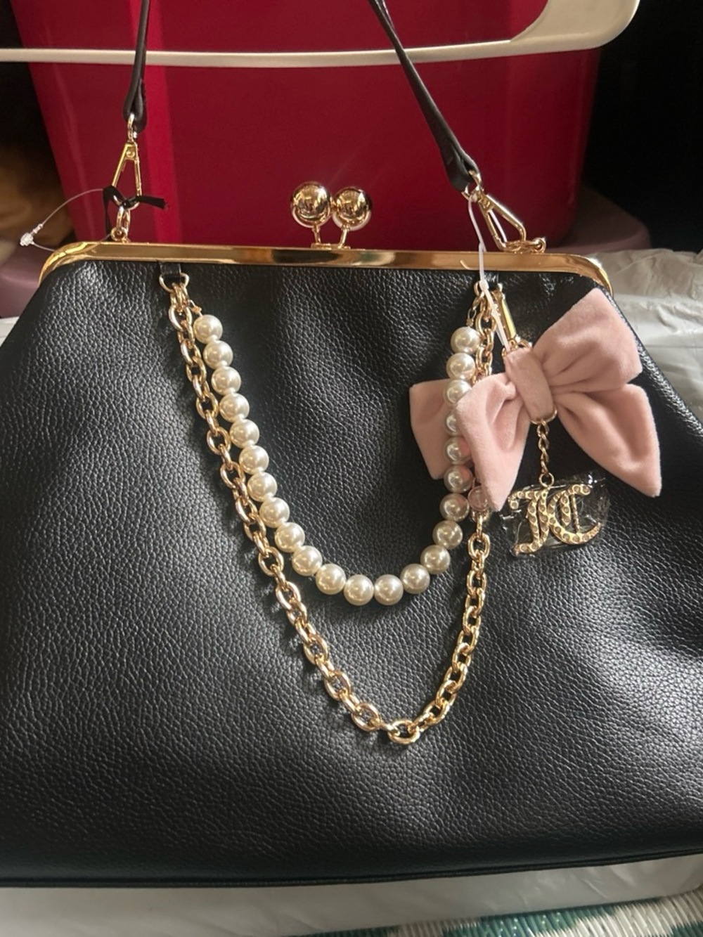 Juicy Couture Exclusive  Kiss lock Black Satchel with Gold Hardware and Pink Bow